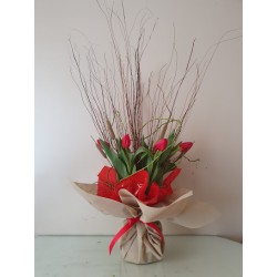 A water bouquet with tulips and brunches